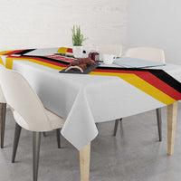 White dining tablecloth with Unity Day 1990 stripe pattern in black, red, and yellow