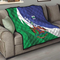 Flag quilt on sofa, green and blue diagonal stripes with white emblem stripe and 1966