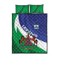 Lesotho quilt bed set with two green pillowcases and matching blue-and-white crest