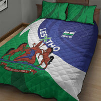 Lesotho quilt bed set with green-and-blue quilt, white diagonal band, and coat of arms