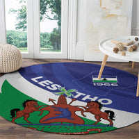 Round Lesotho 1966 rug in blue, green, and white, featuring the national coat of arms