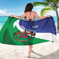 Draped Lesotho flag sarong in blue, white, and green with large coat of arms graphic