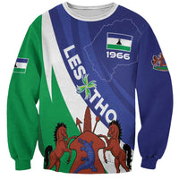Unisex sweatshirt with blue and green spiral panels, 1966 coat of arms graphic
