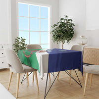 Lesotho flag-style tablecloth draped over table, green and blue crest design