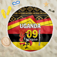Round beach blanket with fringe, Uganda 09 October flag artwork on geometric black band.