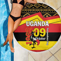 Round beach blanket with fringe, Uganda 09 October graphic flag pattern in black, yellow, red.