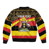 Black bomber jacket with gold geometric yoke, red-yellow stripes, back 'YOUR TEXT' graphic and animals