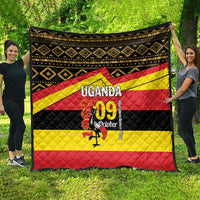 Uganda-themed quilt blanket featuring black diamonds, yellow and red stripes, and “UGANDA 09 October”