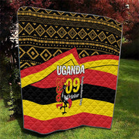 Uganda flag style quilt with black border, repeating diamond pattern, and “UGANDA 09 October” center art