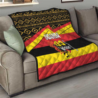 Uganda-themed throw quilt on sofa with black border, yellow/red stripes, and “UGANDA 09 October” graphic