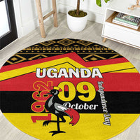 Round Uganda 1969 October carpet with red, yellow, black text and animal silhouette