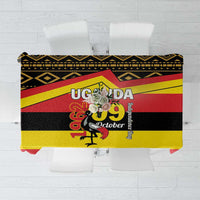 Printed tablecloth with black, yellow, and red Uganda flag-style design and “UGANDA” text