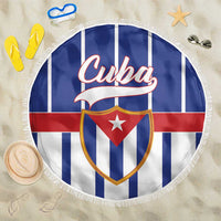 Round Cuba beach blanket with striped pattern, shield logo, and white tassel border
