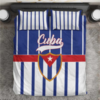 Blue, white, and red striped Cuba bedding set with crest graphic on duvet