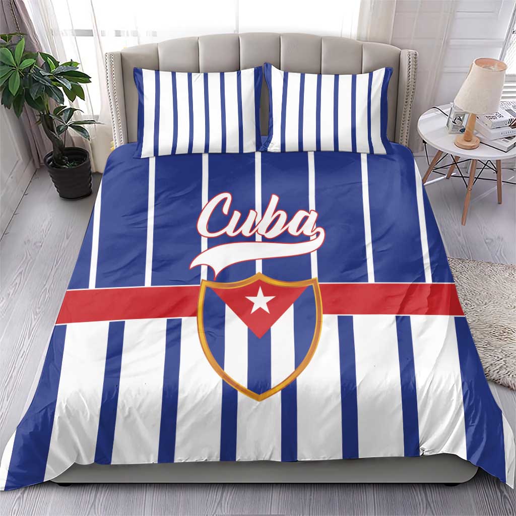 Blue striped Cuba bedding set with crest emblem across the duvet front