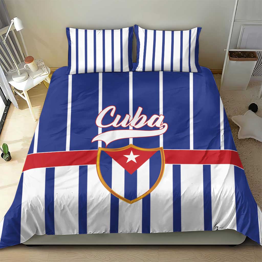 Blue striped Cuba bedding set with matching pillowcases and central crest graphic