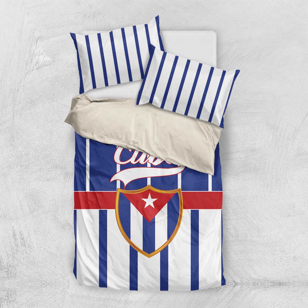 Blue striped Cuba bedding set with visible crest emblem on duvet and pillow