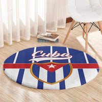 Blue round rug with curved border and Cuba crest logo over striped blue, white, and red