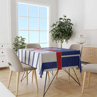 Blue and white striped tablecloth draped over a dining table