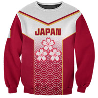 Red and gray sweatshirt with JAPAN text and cherry-blossom pattern front