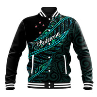 Black baseball jacket with teal Polynesian wave graphic, white trim, snap buttons