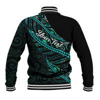 Black baseball jacket with teal Polynesian back graphic and cursive Aotearoa lettering