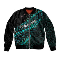 Black unisex bomber jacket with teal-green Polynesian pattern and zip front