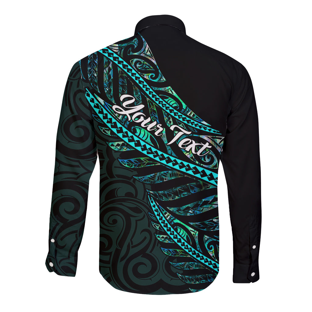 Black long-sleeve button shirt with teal wave pattern and script-style text across back