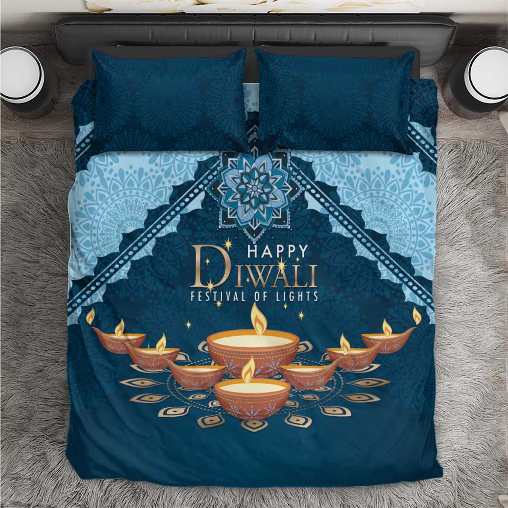 Blue and light-blue Diwali bedding set with 'Happy Diwali' diya pattern, two pillows.