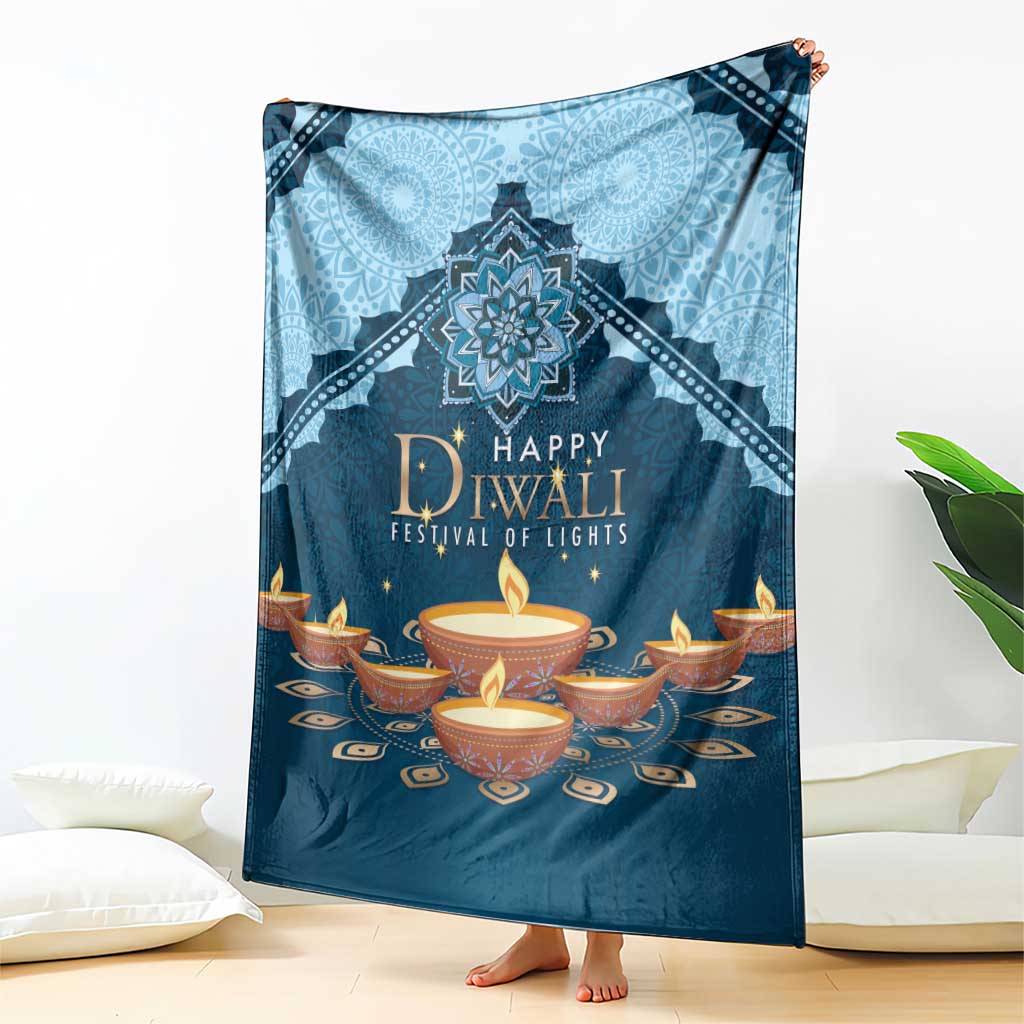 Blue Diwali festival blanket held upright, featuring 'Happy Diwali' candle design