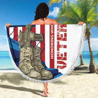 Round beach blanket with fringe edge, white with soldier and rifle US flag graphic, held up by person