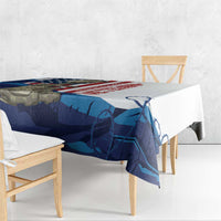 White tablecloth with blue and red patriotic print draped over dining table