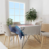 White Veterans Day tablecloth with blue/red memorial print covering rectangular dining table