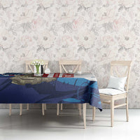 White tablecloth with blue, red, and camouflage military graphic on dining table