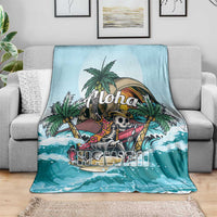 Blue tropical skeleton blanket draped over sofa with palm tree and ocean waves