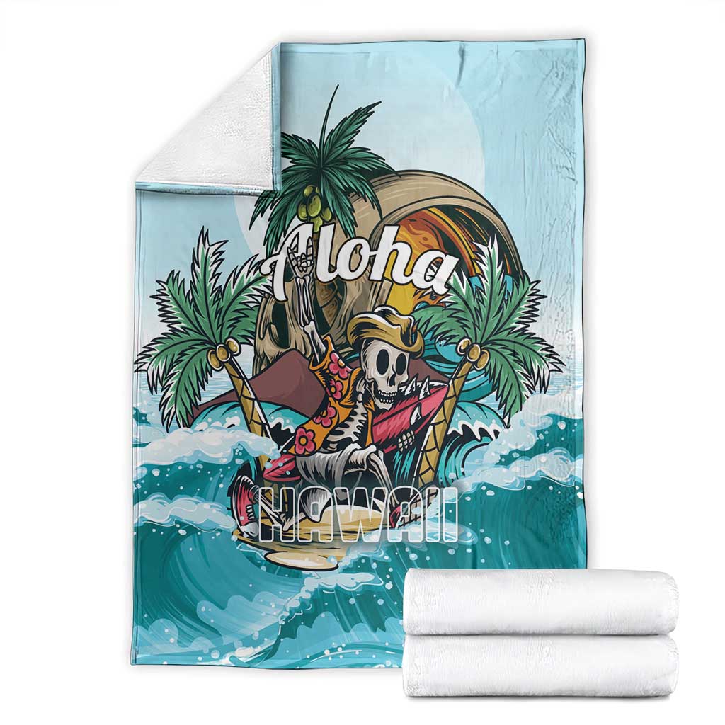 Blue tropical skeleton throw blanket folded with palm tree 'Aloha' design