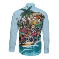 Light blue long-sleeve button-up shirt with tropical skeleton graphic and back text