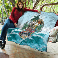 Blue quilt with diamond quilting and tropical “Aloha” graphic, ocean-wave border
