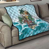 Blue quilt draped on a sofa, diamond stitching with tropical “Aloha” print