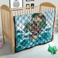 Blue quilt on a light wood bed frame, diamond stitched with “Aloha” tropical print