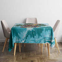Blue round tablecloth with ocean wave pattern and skeleton-themed centerpiece