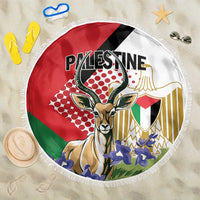 Round beach blanket with gazelle and Palestinian-themed graphic, white fringe edge