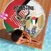 Round beach blanket with gazelle artwork and bold red, green, black and gold design