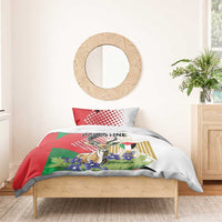 Bedding set on wooden bed with red-green-white gazelle artwork, two pillows, duvet