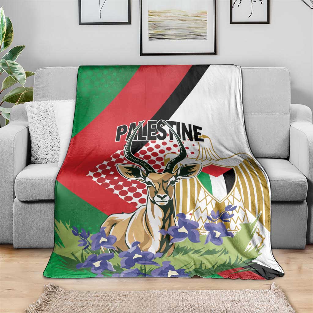 Palestine blanket spread on sofa, gazelle artwork with purple flowers and patterned gold