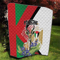 Quilted Palestine blanket with red and green geometric panels, white section, and floral design