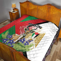 Palestine quilt blanket on bed with red and green stripes and white backing, quilted texture