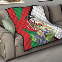 Palestine quilt blanket on gray sofa with quilted diamond texture and red/green/white colors