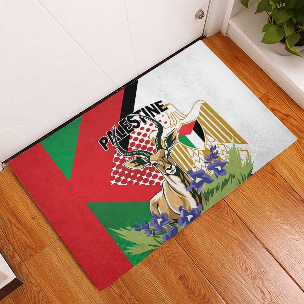 Square rubber doormat on hardwood floor, Palestine Gazelle illustration in red and green