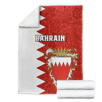 Folded Bahrain-themed red and white blanket with coat-of-arms crest and BAHRAIN text